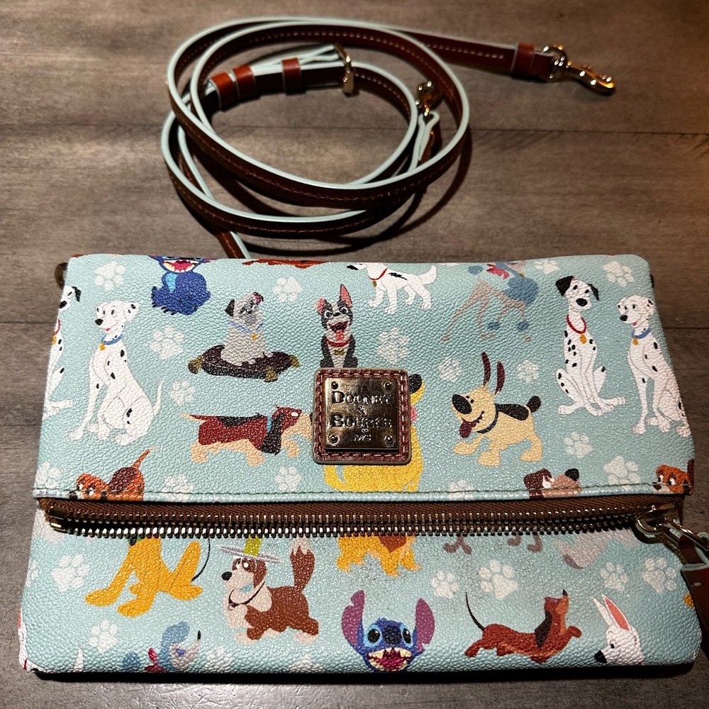 Dooney and Burke x Disney Dogs cross-body or clutch bag in blue.